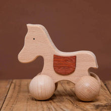 Jouet Montessori en bois cheval à roulettes